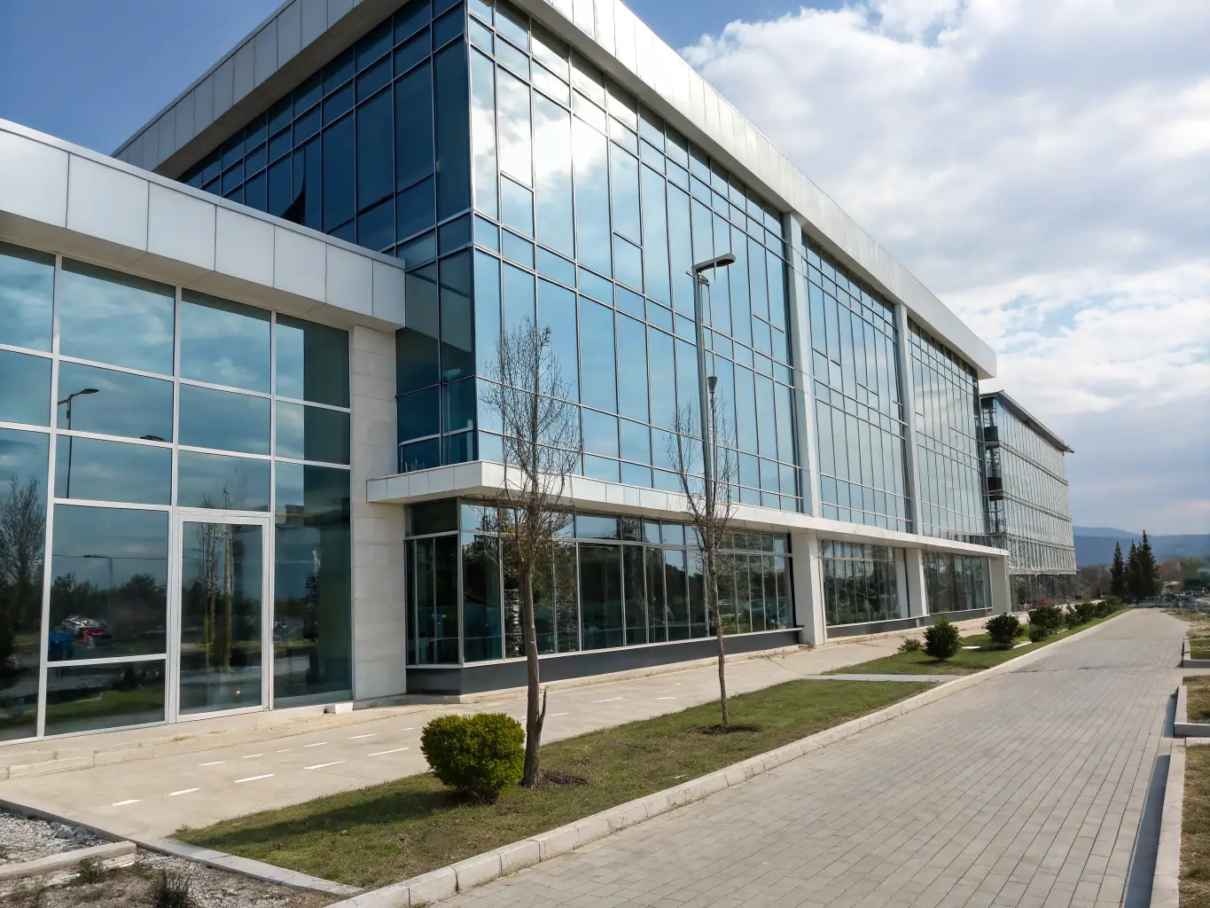 Exterior view of the KZBusinessHub office building in Astana, Kazakhstan, showcasing its modern architecture and professional environment.